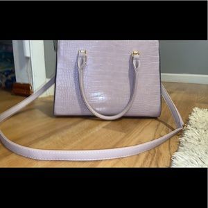 Light purple cross body bag.